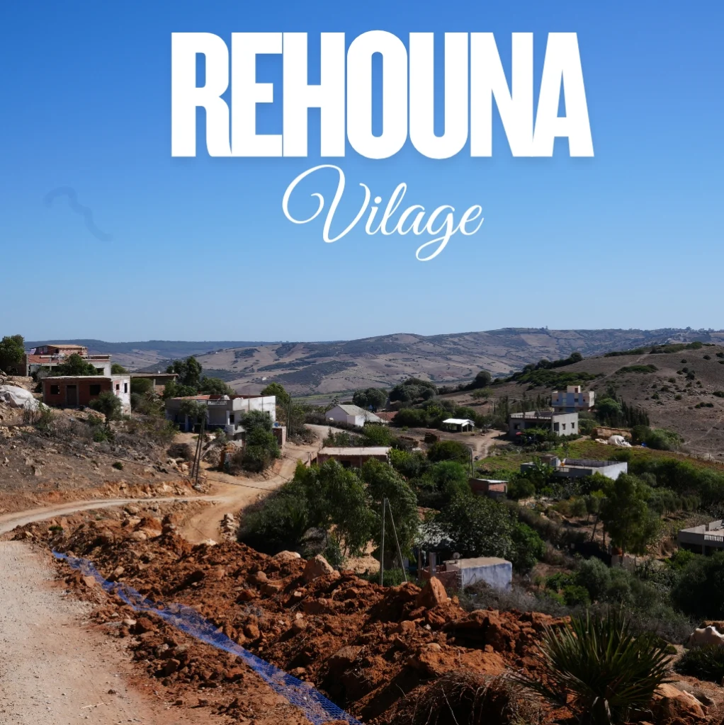 Rehouna Village community association banner showing the village landscape and road, symbolizing local development and support for children